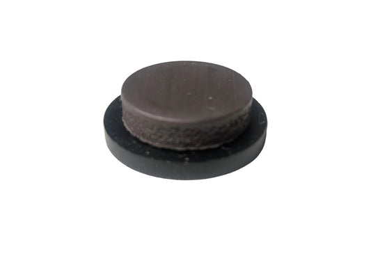 A magnet mounted on the back of display piece