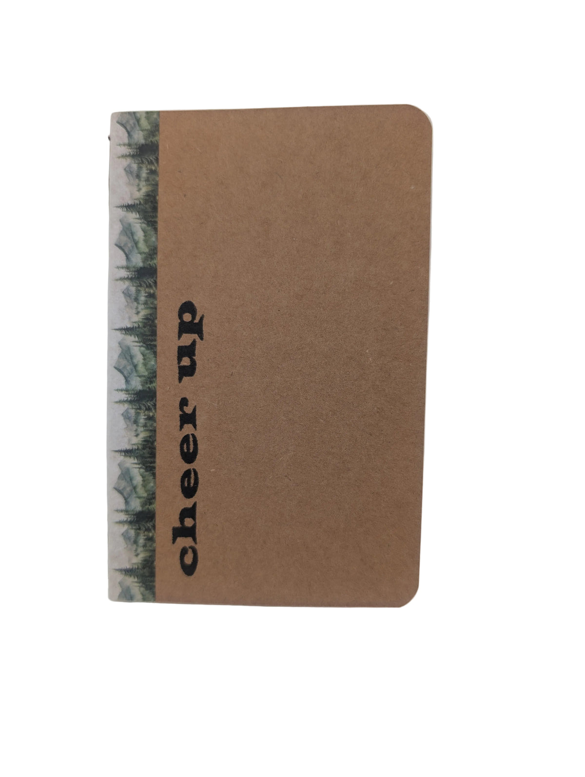 A small kraft paper notebook with a vertical forest patterned spine and the words 'cheer up' printed in black on the front, photographed on a plain light background.